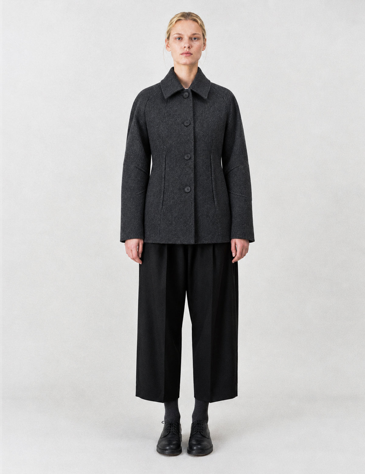 A-line coat with a soft voluminous cut and a concealed button fastening