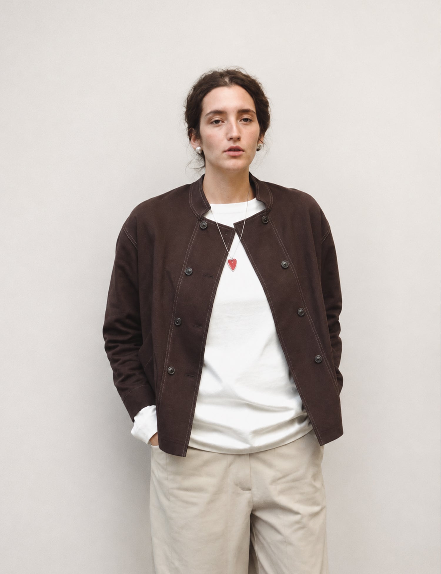 Double-breasted fitted coat with accentuated shoulders in black