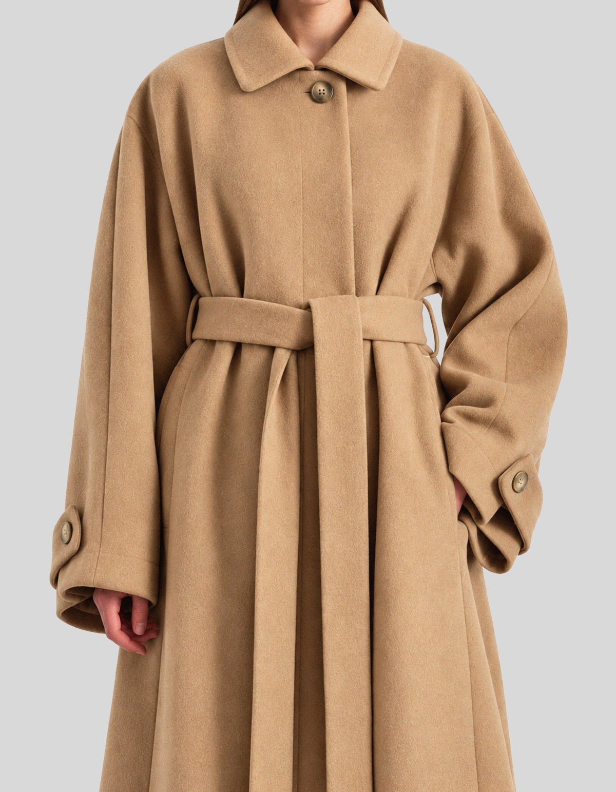 A-line coat with a soft voluminous cut and a concealed button fastening
