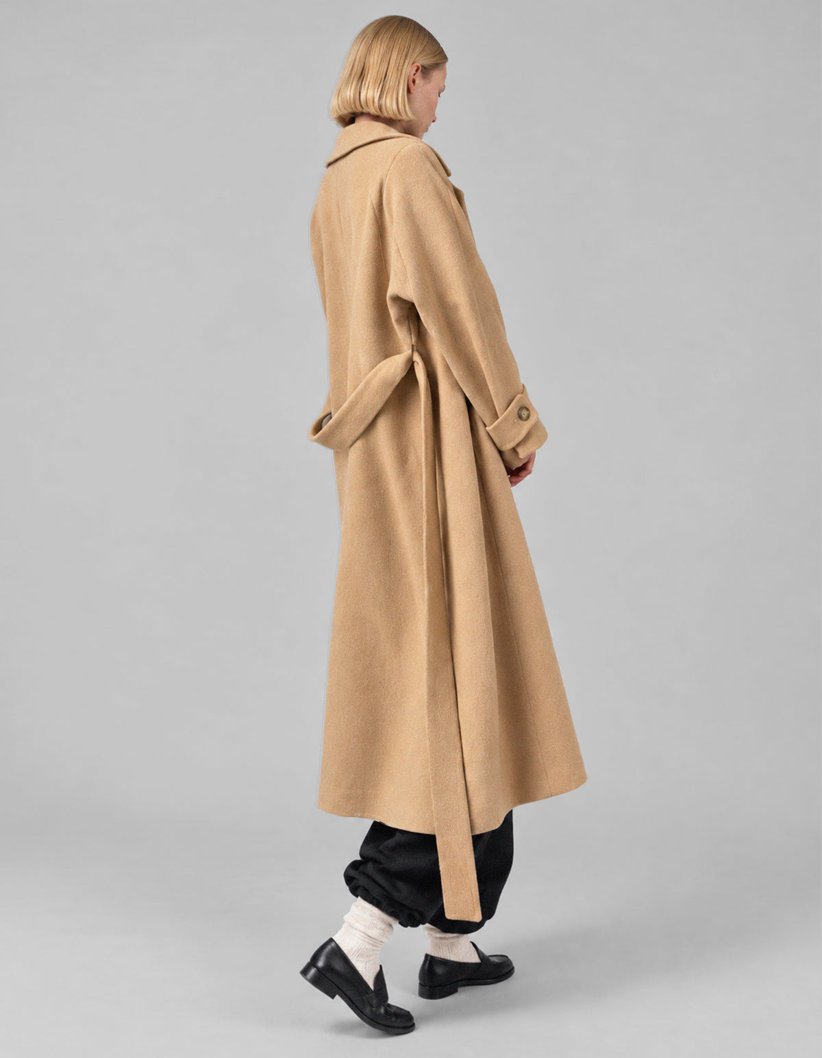 A-line coat with a soft voluminous cut and a concealed button fastening