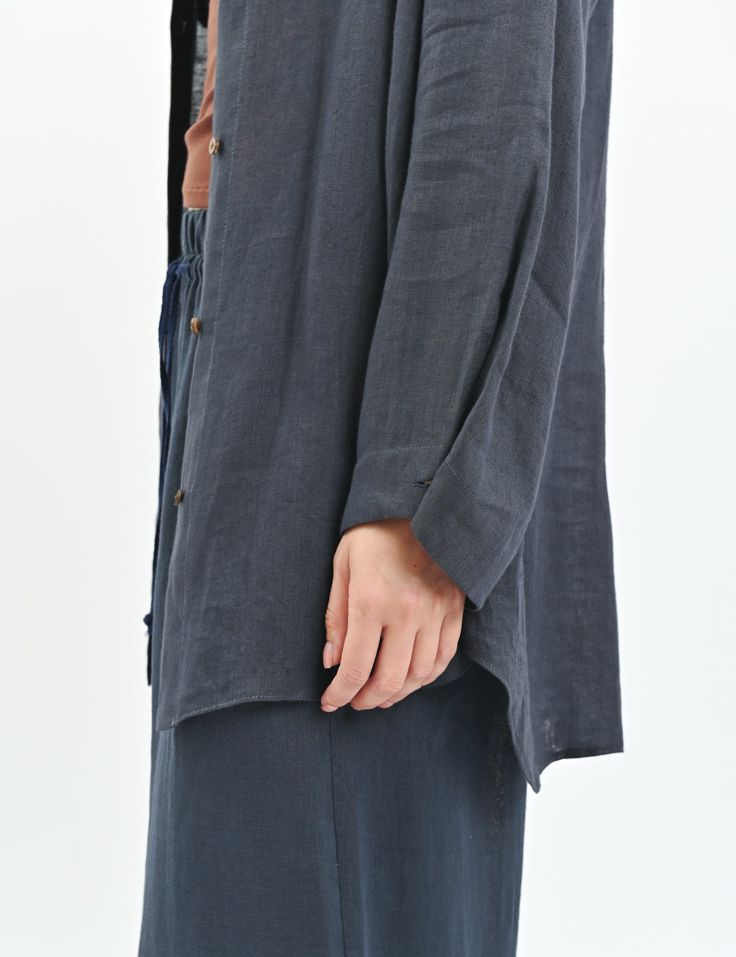 White relaxed-fit linen shirt with dropped shoulders