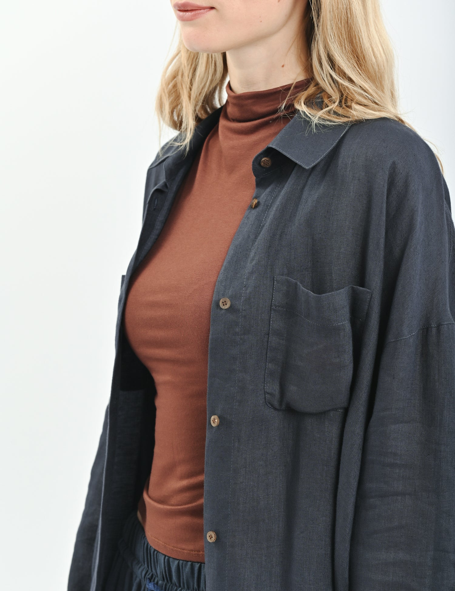 White relaxed-fit linen shirt with dropped shoulders