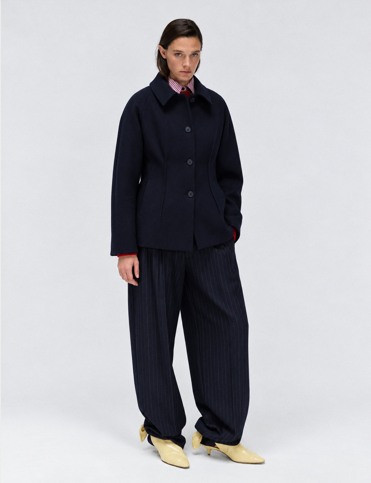 A-line coat with a soft voluminous cut and a concealed button fastening