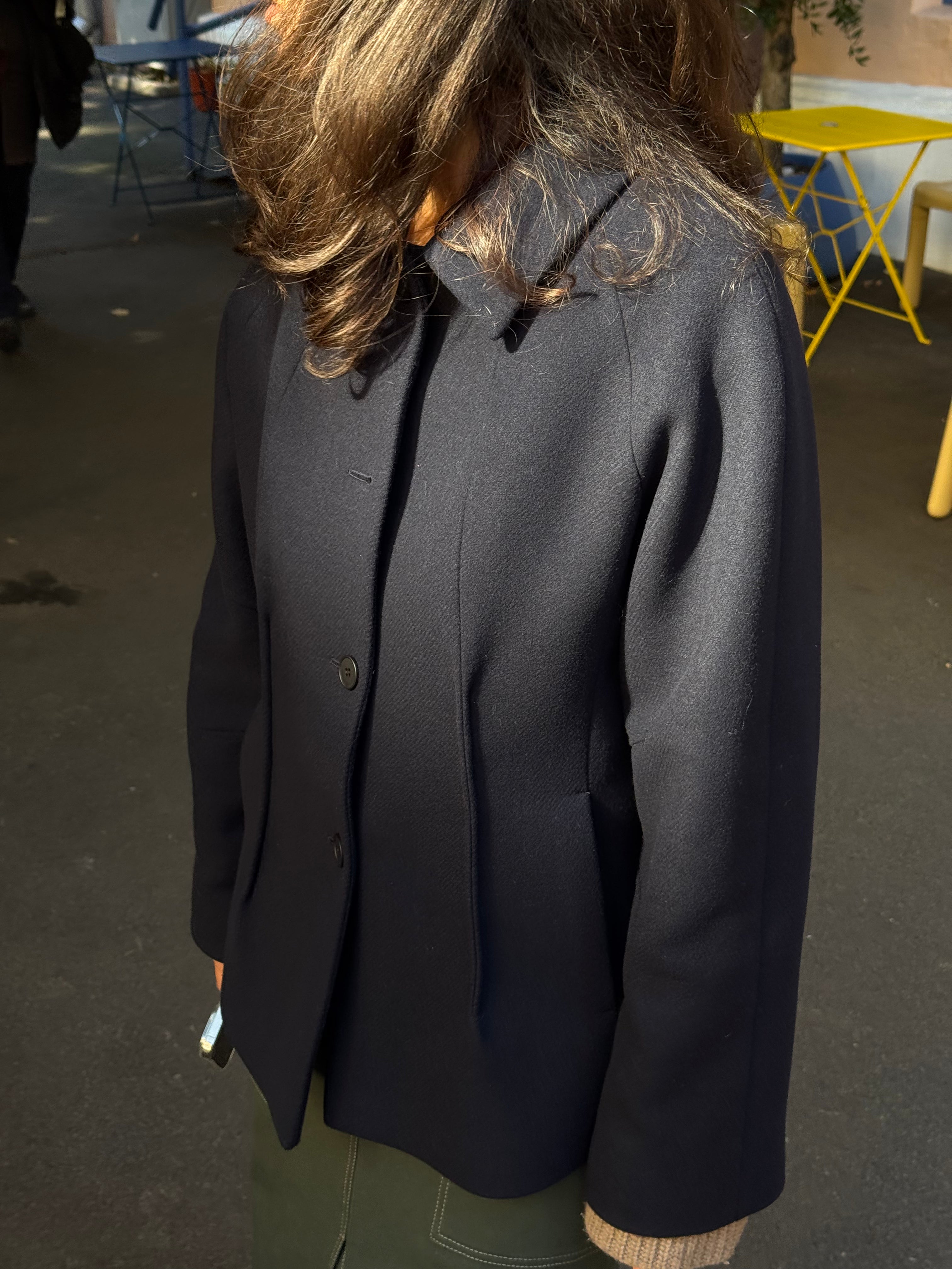 A-line coat with a soft voluminous cut and a concealed button fastening