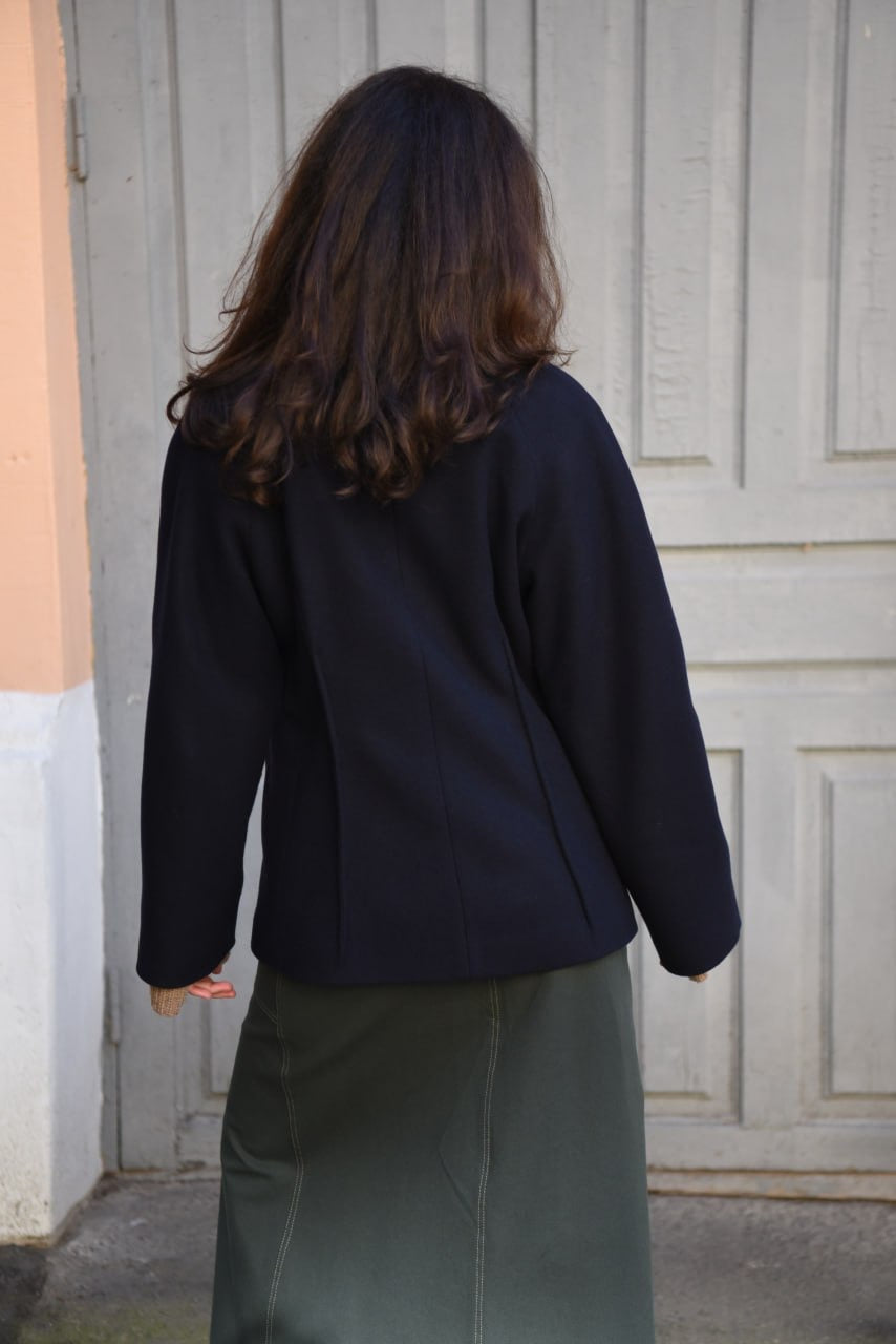 A-line coat with a soft voluminous cut and a concealed button fastening